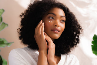 model applying savor beauty skincare