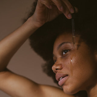 Girl applying cleanser oil